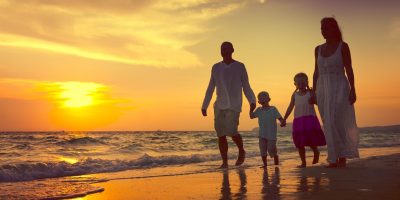 family walking on the beach 10 common cause of alcoholism